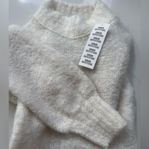 NWT Urban outfitters cream sweater in size small.